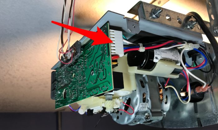 Garage door logic board wire harness connector on Linear with broken motor unit gear